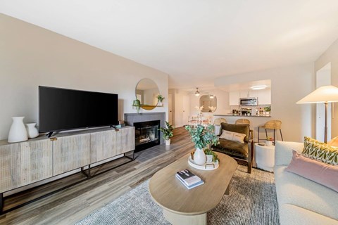 a living room with a large tv and a fireplace  at Citrine Hills, Ontario